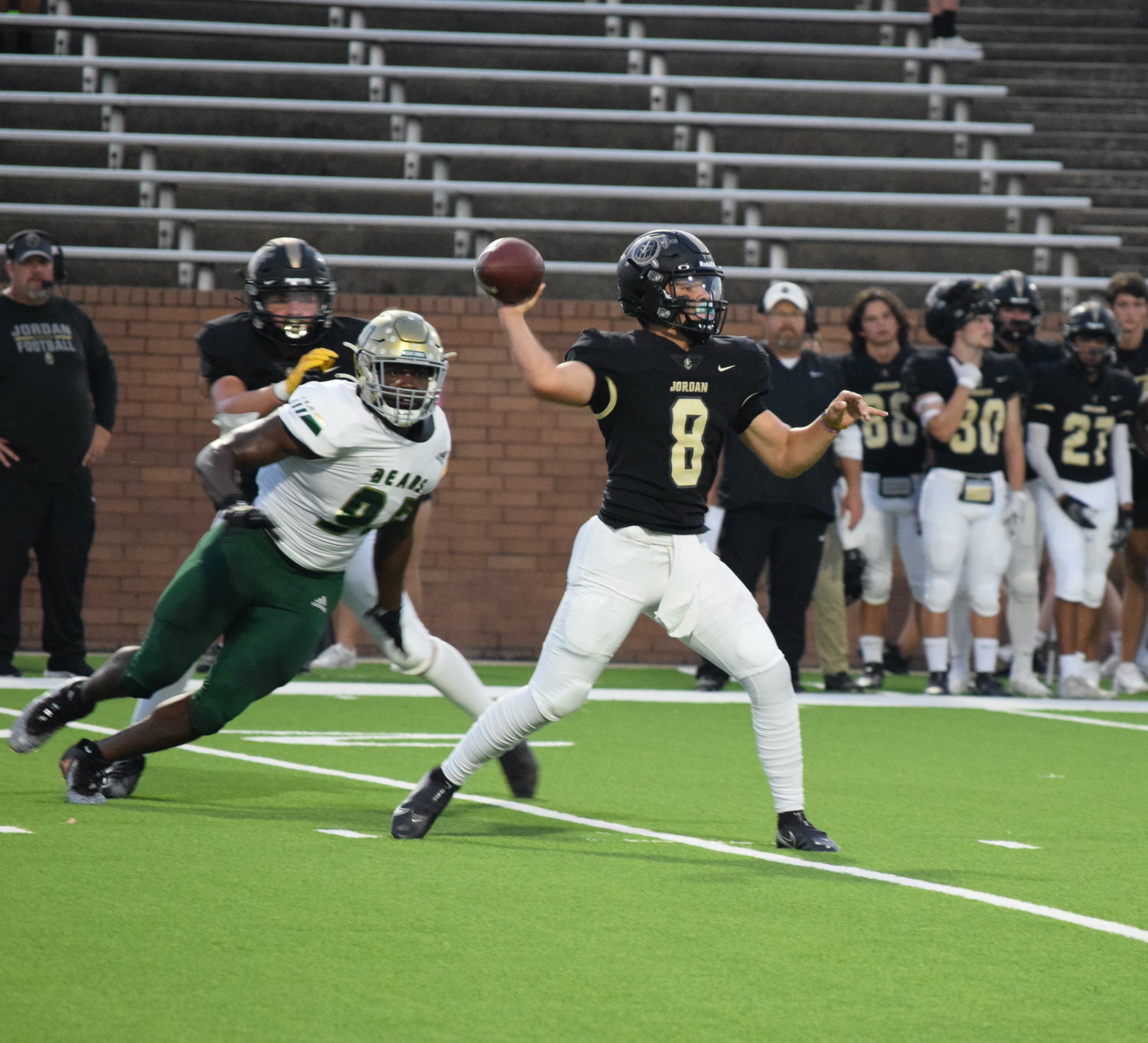 Jordan’s Colin Willetts throws a pass during a game against Little Cypress-Mauriceville on Thursday at Rhodes Stadium.